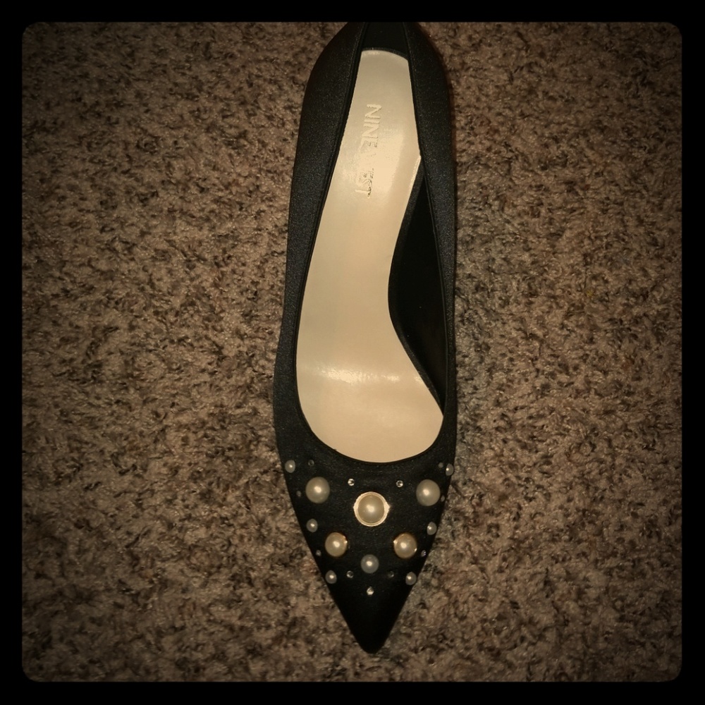 Black satin pumps